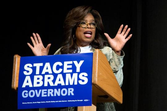 TV titans Trump, Oprah go head to head on U.S. campaign trail