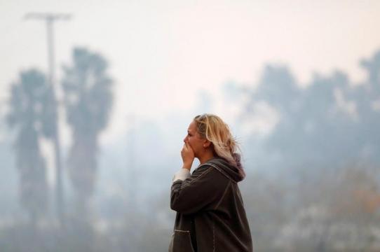 Crews battle California blazes, including state's most destructive