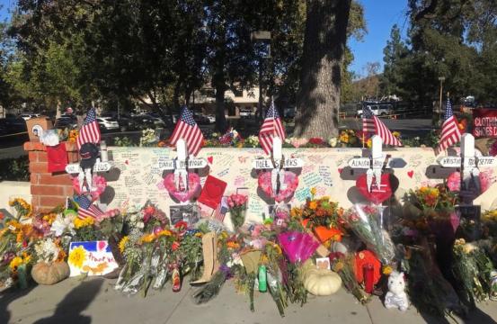 Carpenter erects wooden crosses in honor of shooting rampage victims