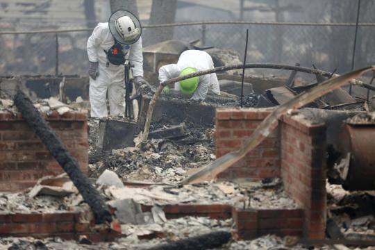 Troops search for 130 missing in California wildfire, death toll climbs to 56