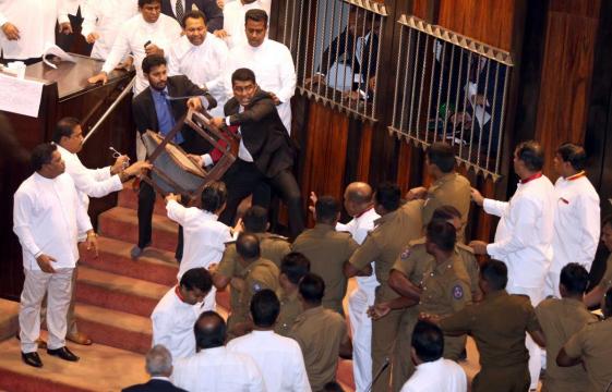 Bottles, chili paste thrown as Sri Lanka parliament descends into farce