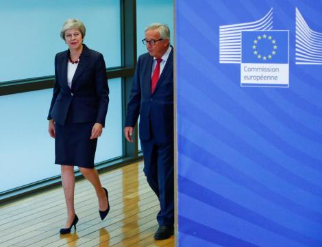 May seeks to cut deal on future EU ties in Brussels