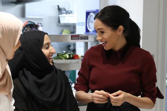Meghan Markle dons apron on return to community kitchen set up after London fire