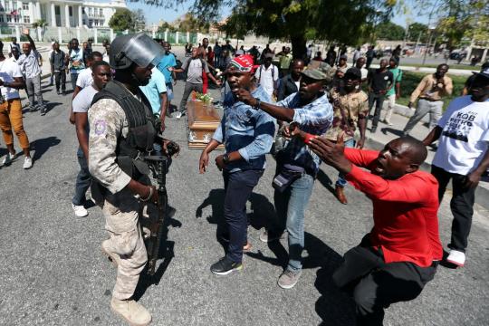 Haiti police fire rubber pellets at mourners as protests resume