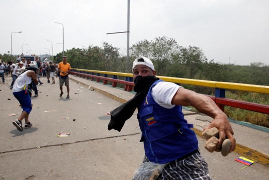 Venezuela humanitarian aid met with teargas and gunfire on borders