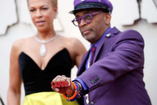 Bold colors as stars arrive for the Oscars