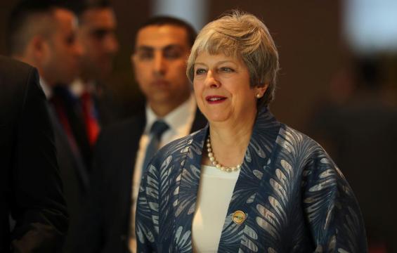 May to rule out no-deal Brexit to stave off rebellion - media reports
