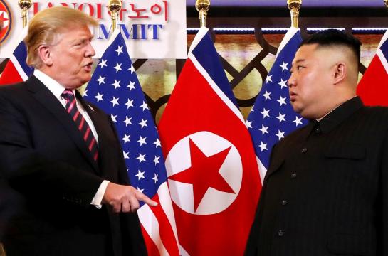 Trump, Kim mind their body language with a handshake of equals