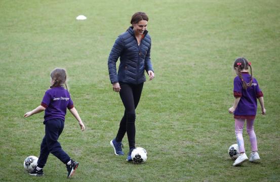 Prince William and Kate show off football skills on surprise Northern Ireland trip