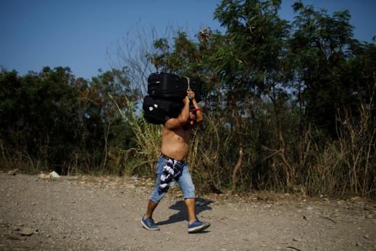 Nearly quarter-million Venezuelans sought asylum in 2018, UNHCR says