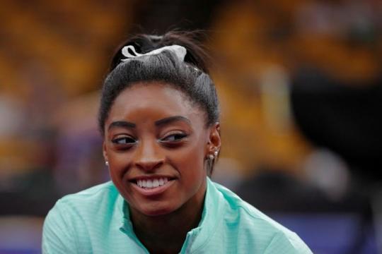 U.S. team heading in positive direction from dark place, says Biles