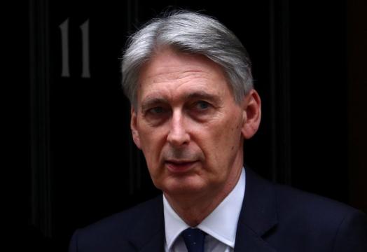 Britain must resolve Brexit but changing PM May wouldn't help, Hammond says