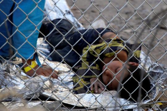 Migrants being held in Texas enclosure as surge overwhelms El Paso