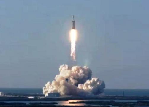 SpaceX’s Falcon Heavy rocket launches its first commercial payload, then aces a triple landing