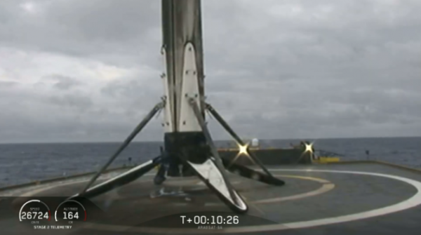 SpaceX’s Falcon Heavy center core booster falls over on ship amid heavy seas