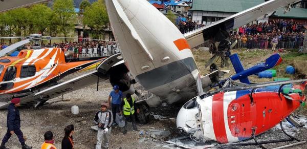 Nepal plane hits parked helicopter while taking off, killing three