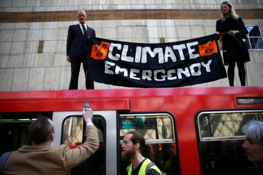 Climate-change protesters disrupt London docklands train service