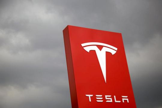 Ending tough week, Tesla sinks to lowest level in two years