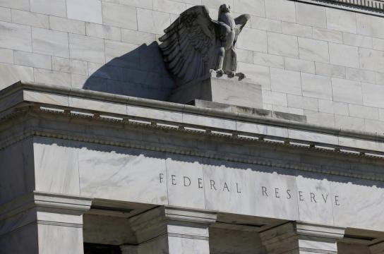 Moore, under fire, withdraws from bid for Fed post