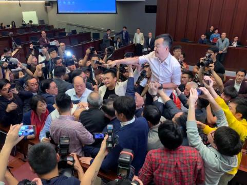 Hong Kong legislators brawl over contentious extradition law
