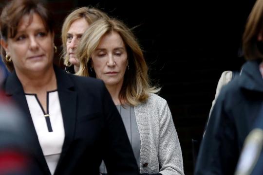 Tearful Felicity Huffman admits role in U.S. college admissions scandal