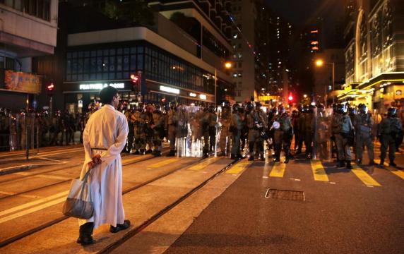 HK police fire teargas as China says it will not 'sit idly by'