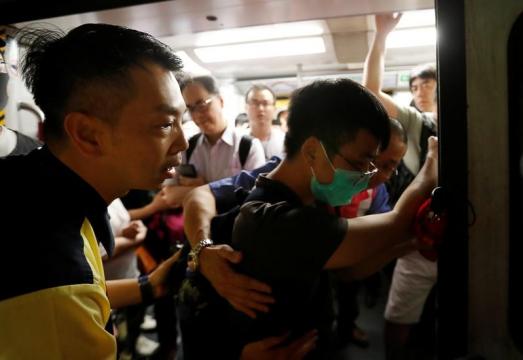 Commuter chaos as protesters seek to shut Hong Kong with general strike