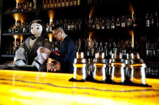 A robot walks into a bar, helps make a cocktail
