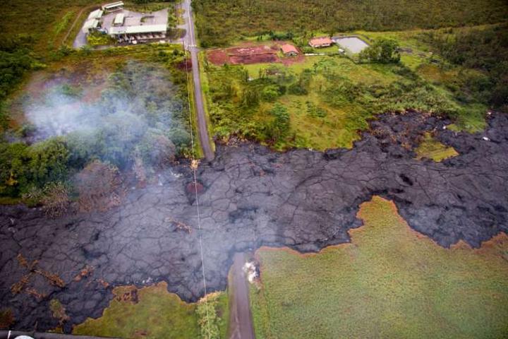 lava cools as it flows across a field in Hawaii