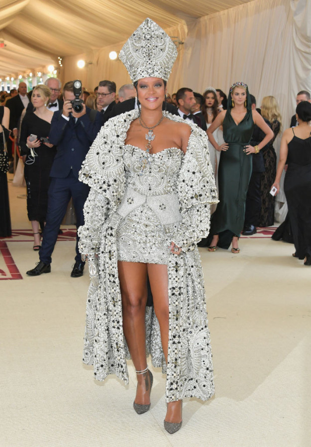 Rihanna popped out at this year's Met Gala, which was all about Catholic imagination, in true Rih fashion.
