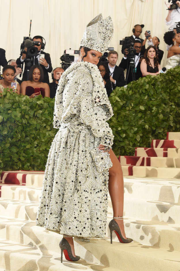 Rih gave us angles on angles: This mitre crown, this strapless beaded minidress, an extravagant robe, and these bedazzled Loubutin heels? A LEWK.
