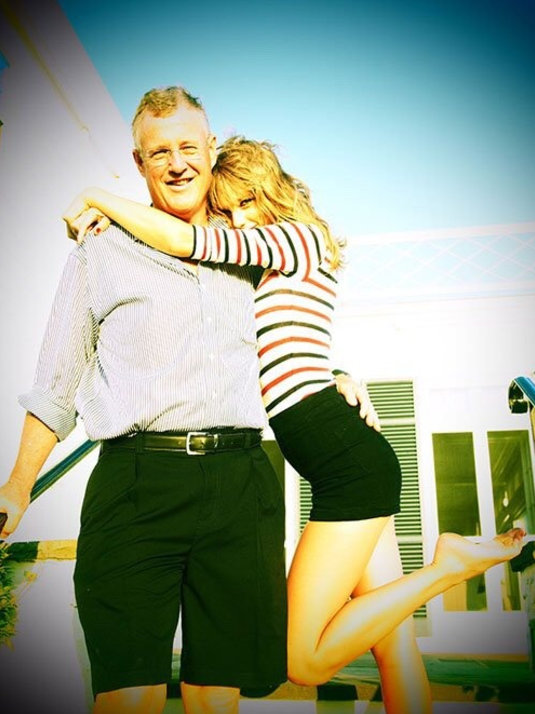 LIKES TO PARTY. Here he is at Taylor's iconic Fourth of July party: