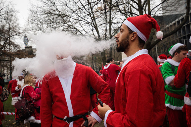 Here's a bunch of dudes at Santa Con vaping.