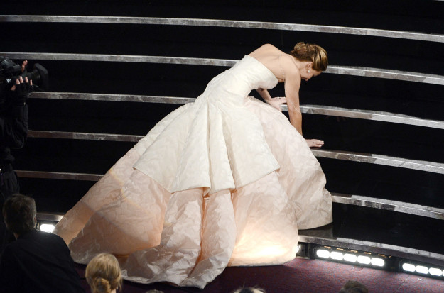 J.Law took a tumble on her way to picking up her Oscar for Silver Linings Playbook.