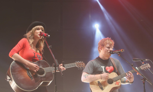 Taylor ALSO brought an up-and-coming artist by the name of Ed Sheeran on her Red Tour.