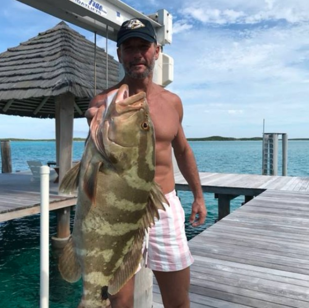 This here pic of him and a fish that I assume he caught.