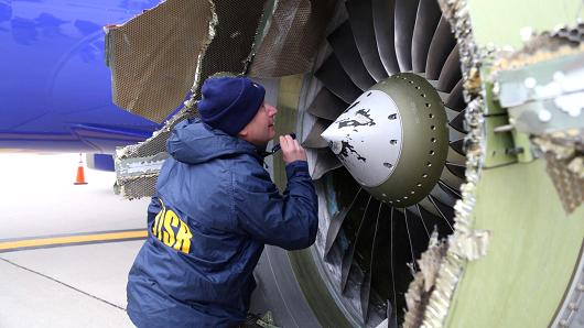 A U.S. NTSB investigator is on scene examining damage to the engine of the Southwest Airlines plane in this image released from Philadelphia, Pennsylvania, U.S., April 17, 2018.