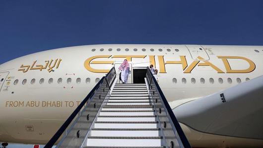 An attendee at the Dubai Air Show enters an aircraft on Nov. 13, 2017, in Dubai, United Arab Emirates.