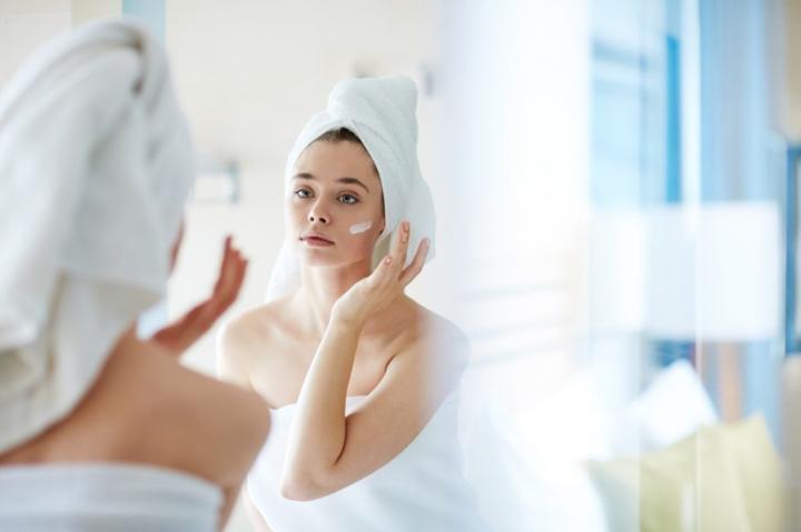 moisturizer-woman-towel-bathroom-1024x682.jpg