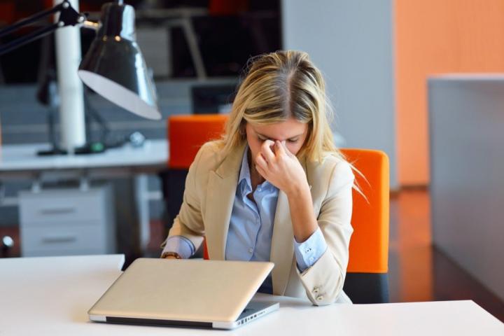 frustrated-woman-pinching-nose-in-office-1024x683.jpg