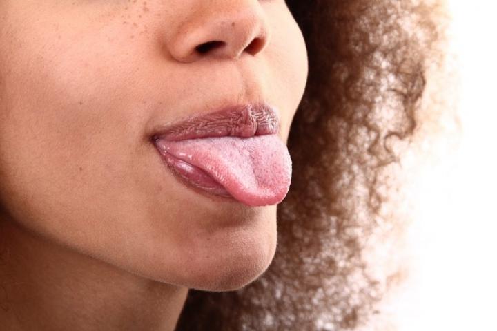 curly-haired-woman-sticking-tongue-out-1024x682.jpg