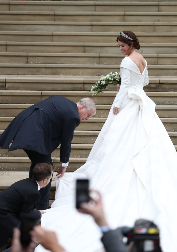 Andrew-helped-Eugenie-her-gown-while-arriving-her-wedding.jpg