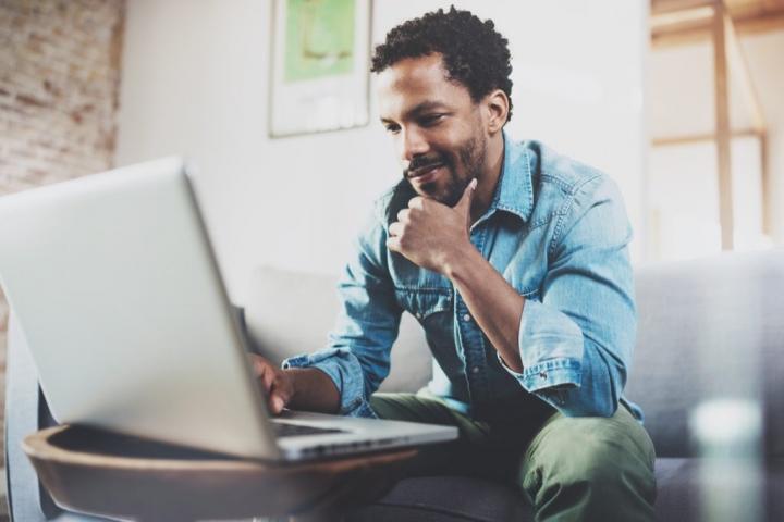 man-smiling-at-laptop-long-distance-relationships-1024x683.jpg