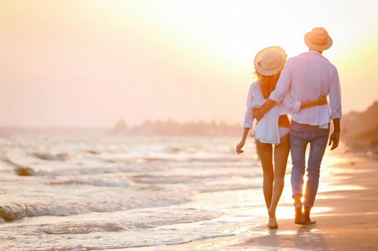 couple-walking-on-a-beach-at-sunset-1024x683.jpg