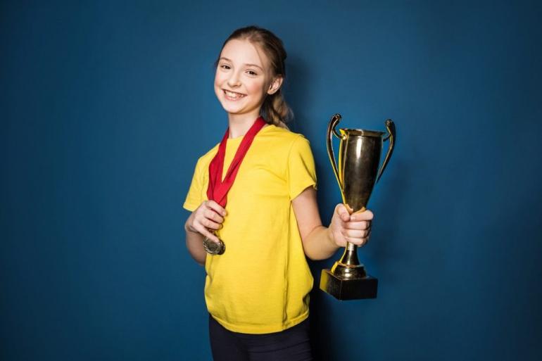 girl-with-trophy-1024x683.jpg