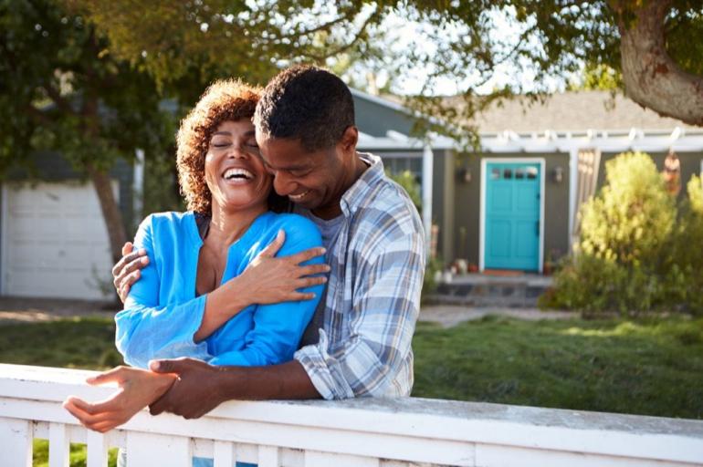 couple-outdoors-by-house-laughing-1024x682.jpg