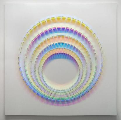 Mesmerizing rainbow-colored sculptures are made with dichroic glass