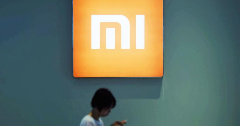 Shares of Chinese smartphone maker Xiaomi open for trade below IPO price