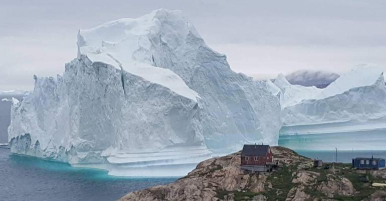A Giant Iceberg Parked Offshore. It’s Stunning, but Villagers Hit the Road.
