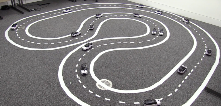 A fleet of miniature cars for experiments in cooperative driving